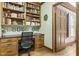 Functional home office with built-in bookshelves, desk, and wood flooring for a productive workspace at 504 W Brocklyn St, Benson, NC 27504