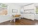 Bright kitchen with white cabinets, an eat-in area, and modern appliances at 504 W Brocklyn St, Benson, NC 27504