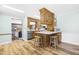 Stylish kitchen featuring wood cabinets, barstool seating, and stainless steel appliances at 504 W Brocklyn St, Benson, NC 27504