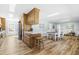 Bright kitchen features an island, wood cabinets, stainless steel appliances, and space for dining at 504 W Brocklyn St, Benson, NC 27504