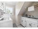Laundry room with washer, dryer, and window at 504 W Brocklyn St, Benson, NC 27504