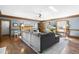 Spacious living room with hardwood floors, fireplace, and large sectional sofa for comfortable living at 504 W Brocklyn St, Benson, NC 27504