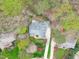 Aerial view of house and neighborhood showing landscaping, driveway, and surrounding trees at 506 Rose Point Dr, Cary, NC 27518