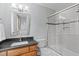 Bathroom featuring a single vanity and a shower with a glass sliding door at 506 Rose Point Dr, Cary, NC 27518