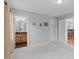 Bedroom with light blue walls, carpet and doors leading to the bathroom and hallway at 506 Rose Point Dr, Cary, NC 27518