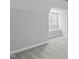 Bedroom with plush carpet, light blue walls, and a large window with a window seat at 506 Rose Point Dr, Cary, NC 27518