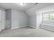 Bedroom with plush carpet, light blue walls, window seat, and a closet at 506 Rose Point Dr, Cary, NC 27518