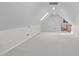 Large bonus room with skylight and recessed lighting is ready for customization at 506 Rose Point Dr, Cary, NC 27518