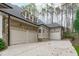 Luxury home showcases a three-car garage, stone accents, and a durable roof at 506 Rose Point Dr, Cary, NC 27518