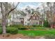 Beautiful home exterior with manicured landscaping and a welcoming front yard at 506 Rose Point Dr, Cary, NC 27518