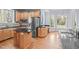 Beautiful kitchen features stainless appliances, granite counters, hardwood floors, and custom cabinets at 506 Rose Point Dr, Cary, NC 27518