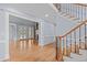 Elegant living room with gleaming hardwood floors, and seamless entryways into adjoined rooms at 506 Rose Point Dr, Cary, NC 27518
