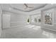 Large bedroom features plush carpet, recessed lights, a ceiling fan, and a door to the outside at 506 Rose Point Dr, Cary, NC 27518