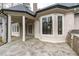 Enjoy seamless indoor-outdoor living on the patio with stone flooring and stunning backyard views at 506 Rose Point Dr, Cary, NC 27518