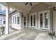 The covered patio offers a serene retreat with ample seating space and outdoor ceiling fans at 506 Rose Point Dr, Cary, NC 27518