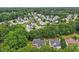 A beautiful aerial view of the neighborhood surrounded by a lush green canopy of mature trees at 5144 Pinehall Wynd, Raleigh, NC 27604