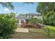 Charming home featuring a screened-in porch, deck, and lush backyard at 5144 Pinehall Wynd, Raleigh, NC 27604