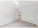 Bedroom featuring carpeted floors and a closet, leading to the stairs at 5144 Pinehall Wynd, Raleigh, NC 27604