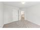 Neutral bedroom with carpeted floors, and easy access to a staircase through an open door at 5144 Pinehall Wynd, Raleigh, NC 27604