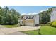 Exterior of a two-story home featuring brick and vinyl siding and an attached garage at 5144 Pinehall Wynd, Raleigh, NC 27604