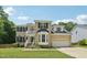 Charming two-story brick home with a manicured lawn and an attached two-car garage at 5144 Pinehall Wynd, Raleigh, NC 27604
