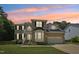 Beautiful two-story brick home with manicured lawn and attached two-car garage at 5144 Pinehall Wynd, Raleigh, NC 27604