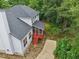 Aerial view of a white two-story home featuring a screened-in porch and backyard patio at 5144 Pinehall Wynd, Raleigh, NC 27604