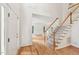 Entryway featuring hardwood floors, staircase, and wainscoting at 5144 Pinehall Wynd, Raleigh, NC 27604