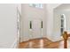 Elegant foyer featuring hardwood floors, and a door with sidelights at 5144 Pinehall Wynd, Raleigh, NC 27604