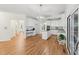 Bright, open kitchen with white cabinets, granite counters, and modern appliances at 5144 Pinehall Wynd, Raleigh, NC 27604