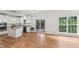 Open eat-in kitchen with sliding glass doors to deck and large windows to the backyard at 5144 Pinehall Wynd, Raleigh, NC 27604