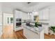 Modern kitchen with granite counters, island cooktop and stainless steel appliances at 5144 Pinehall Wynd, Raleigh, NC 27604