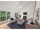 Inviting living room with cathedral ceiling, hardwood floors and charming fireplace at 5144 Pinehall Wynd, Raleigh, NC 27604