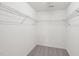 Walk-in closet with wire shelving and neutral carpet at 5144 Pinehall Wynd, Raleigh, NC 27604