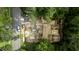 Aerial view of a home under construction with lumber and construction vehicles at 5205 Quail Meadows Dr, Raleigh, NC 27609
