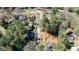 Construction site surrounded by mature trees showing the foundation of a new home at 5205 Quail Meadows Dr, Raleigh, NC 27609