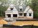 New construction features a two-car garage and landscaping ready for customization at 5205 Quail Meadows Dr, Raleigh, NC 27609