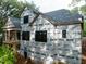 Side view of home under construction with large windows and a spacious deck area at 5205 Quail Meadows Dr, Raleigh, NC 27609