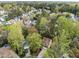Neighborhood aerial view featuring houses surrounded by lush trees, showcasing the community's serene and green environment at 5301 Tilford Ln, Raleigh, NC 27613