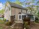 Backyard featuring a deck, screened in porch, and fenced in yard at 5301 Tilford Ln, Raleigh, NC 27613