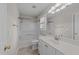 Well-lit bathroom featuring a single vanity and tub/shower combo at 5301 Tilford Ln, Raleigh, NC 27613