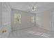 Bright bedroom with neutral walls, carpet, and windows at 5301 Tilford Ln, Raleigh, NC 27613