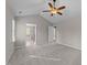 Spacious bedroom with a ceiling fan, and access to the bathroom at 5301 Tilford Ln, Raleigh, NC 27613