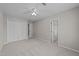 Spacious bedroom with carpet, ceiling fan, and closet at 5301 Tilford Ln, Raleigh, NC 27613