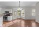 Breakfast nook with generous light exposure, next to kitchen at 5301 Tilford Ln, Raleigh, NC 27613