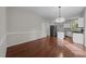 Hardwood floor dining room next to kitchen area at 5301 Tilford Ln, Raleigh, NC 27613