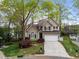 Inviting two-story home with manicured lawn and mature trees in a desirable neighborhood at 5301 Tilford Ln, Raleigh, NC 27613