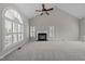 Bright, airy living room with large windows, fireplace, and neutral carpet at 5301 Tilford Ln, Raleigh, NC 27613