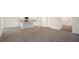 Open living room features modern wood-look floors and transitions into a bright kitchen at 6029 Sodium St, Raleigh, NC 27610