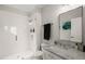 Modern bathroom featuring a glass-enclosed shower, marble countertop, and stylish fixtures at 605 Smedes Pl # A, Raleigh, NC 27605